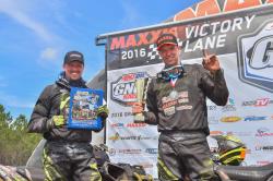 Kevin Trantham holds the trophy and Michael Swift, who finished second at the 2016 WildBoar GNCC.