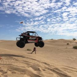 Queen Racing of Lake Havasu City, Arizona jumping a UTV in the dunes