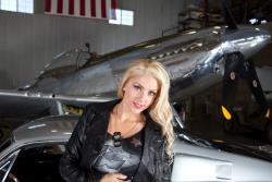 Courtney Day head shot in hangar with P51 Mustang and Ford Mustang